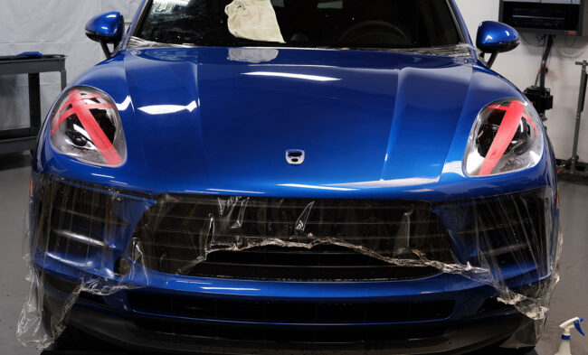 understanding-automotive-paint-portection-film-and-its-history-elite-auto-spa-fresno-ca blue Porsche Macan with clear bra being installed